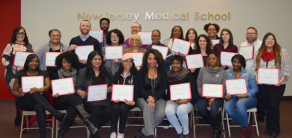 Photo of recipients in the Ryan White Part A Program 2017 HIV MCM Training with their certificates.